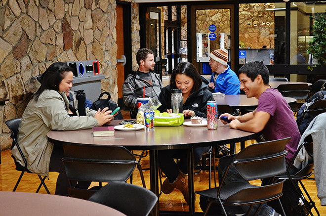 Students enjoy lunch in the cafeteria and socialize together in a safe atmosphere.