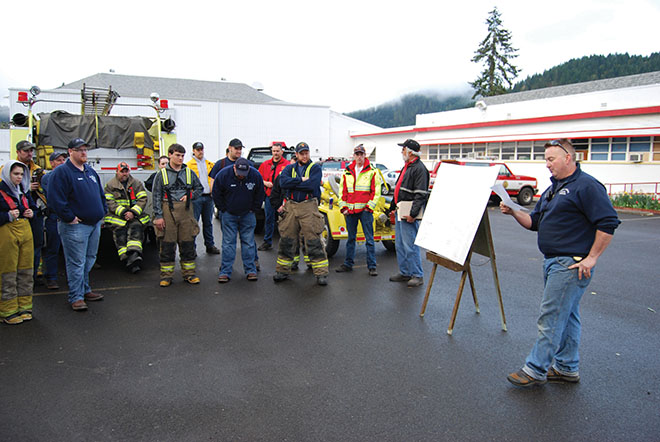 Days Creek Fire Chief Kyle Ward instructs his crew