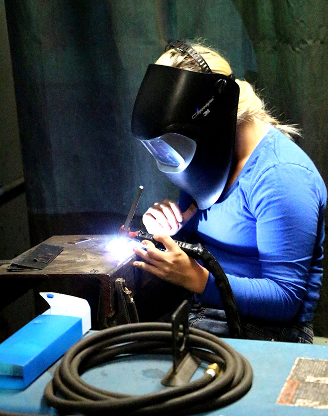 Jessica Powell practices her skills during a welding class at UCC. Many students have found  employment opportunities as welders in Douglas County and Oregon following graduation.