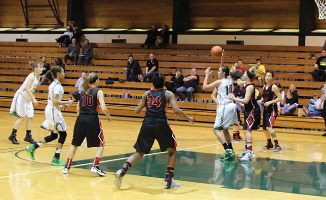 The ‘Hawks used their size inside against Mt. Hood during 
their game on Jan. 25. UCC utilized their Forwards, Pilialoha Kailiawa (pictured with ball), Marcy Ortiz, Ashli Payne, Leilani Morris, Asia Smith, and Kayla Bice, grabbing 36 of the 54 team rebounds.